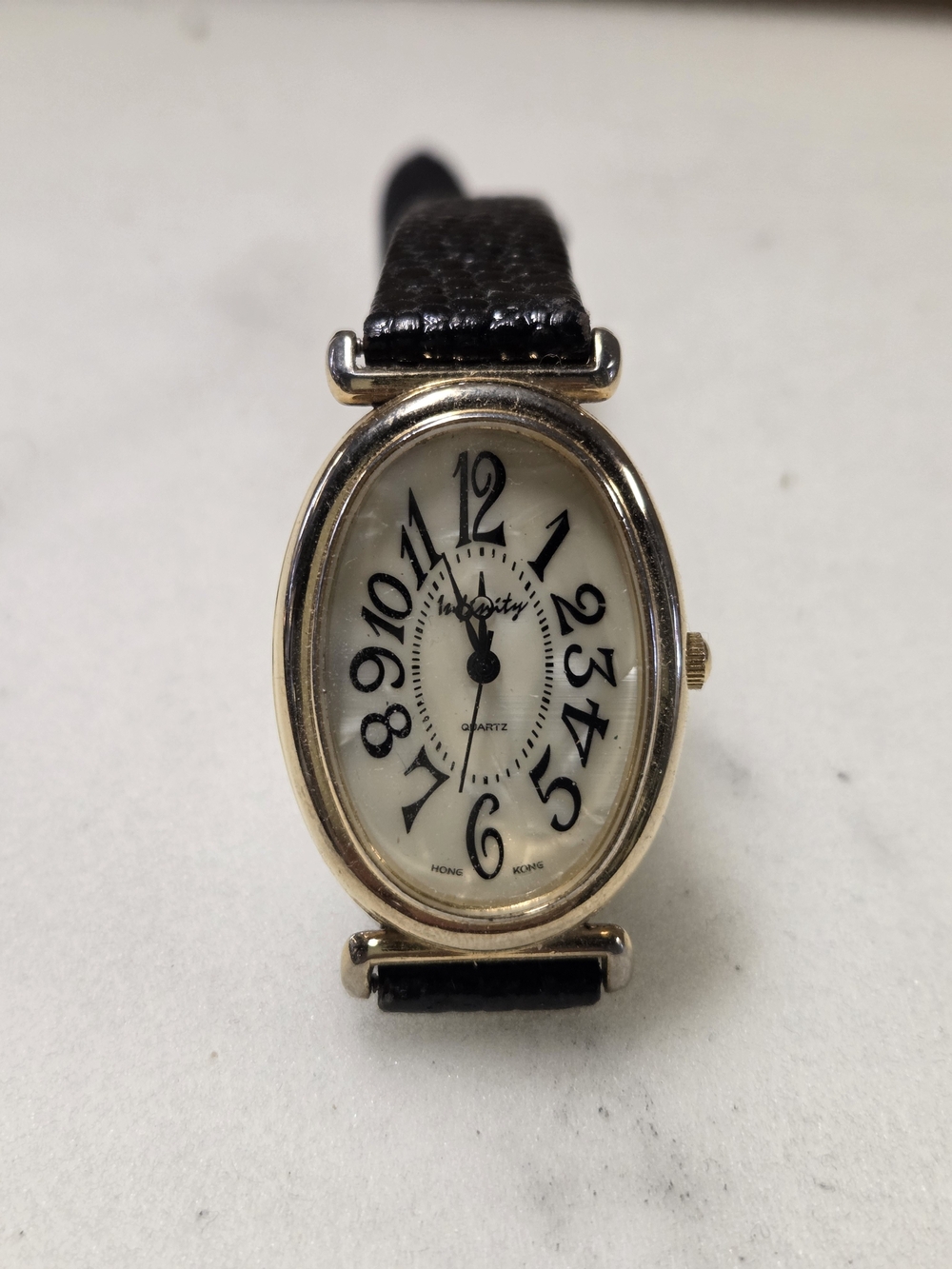 Gold-Tone Oval Quartz Watch with Black Leather Strap By INFINITY New Battery